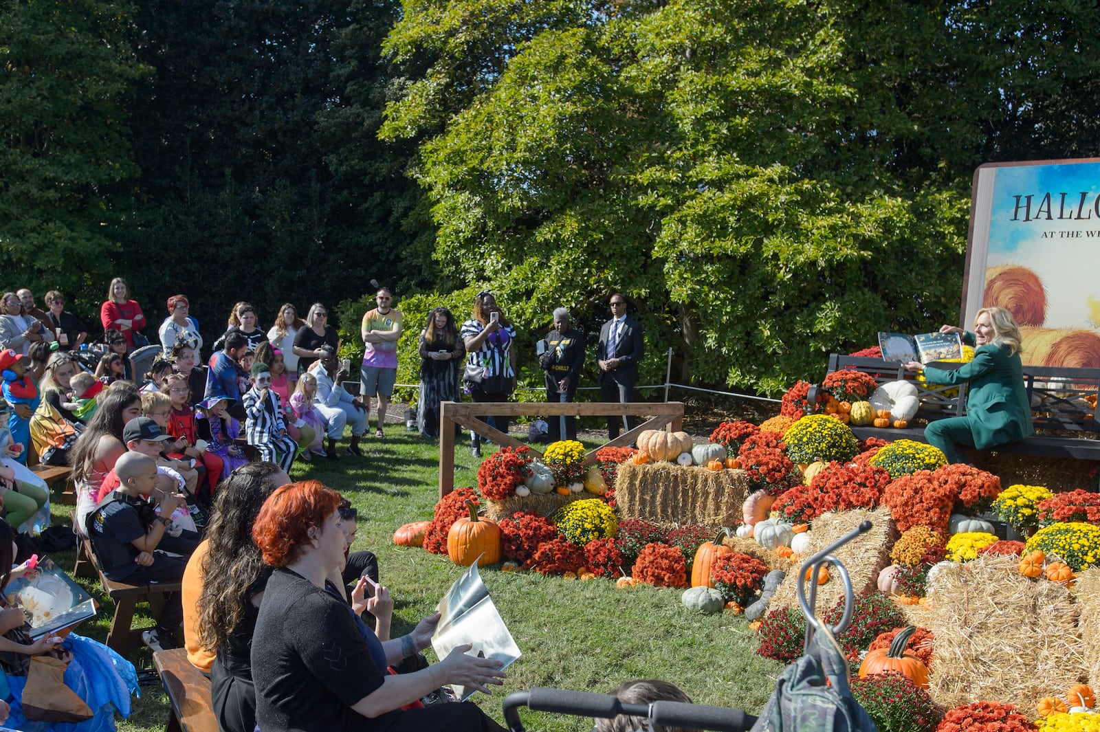 First lady Jill Biden participates in a "Hallo-READ" story-time session by reading the book "10 Spooky Pumpkins" by Gris Grimly to children on the South Lawn of the White House in Washington, Wednesday, Oct. 30, 2024. (AP Photo/Rod Lamkey, Jr.)