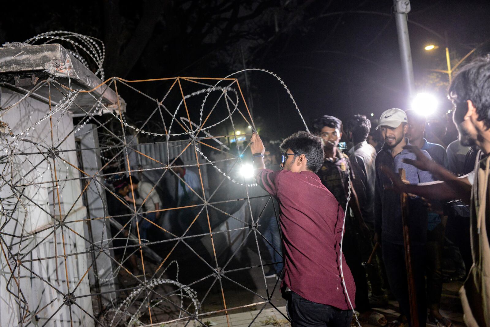 Protesters vandalize the residence of Sheikh Mujibur Rahman, Bangladesh's former leader and the father of the country's ousted Prime Minister Sheikh Hasina, at Dhanmondi, in Dhaka in Dhaka, Bangladesh, Wednesday, Feb. 5, 2025. (AP Photo/Mahmud Hossain Opu)