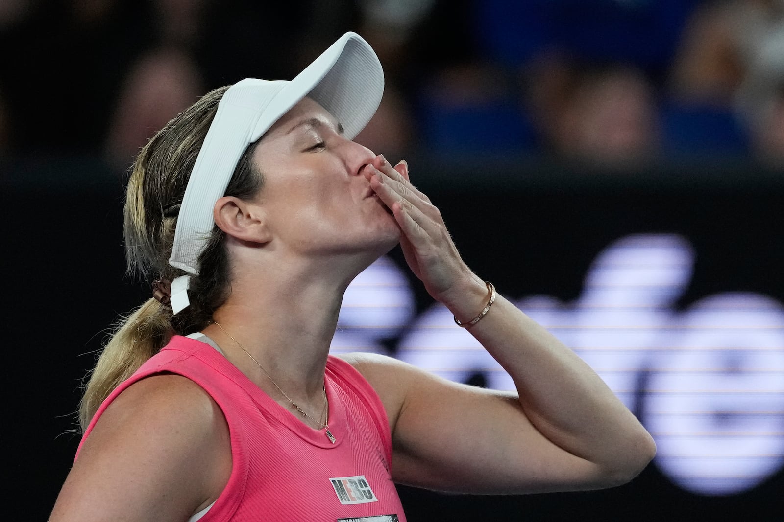 Danielle Collins of the U.S. reacts after defeating Destanee Aiava of Australia in their second round match at the Australian Open tennis championship in Melbourne, Australia, Thursday, Jan. 16, 2025. (AP Photo/Manish Swarup)