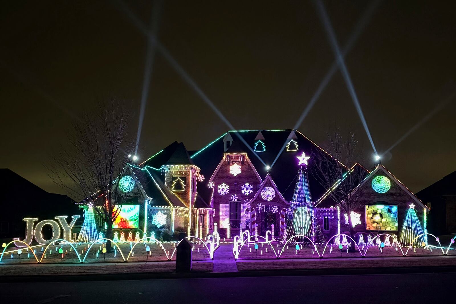 An elaborate holiday light display featuring music and imagery from the movie "Wicked" lights up the home of Elisabeth and Mark Miranda in Edmond, Okla.,, on Dec. 8, 2024. (Elisabeth Miranda via AP)