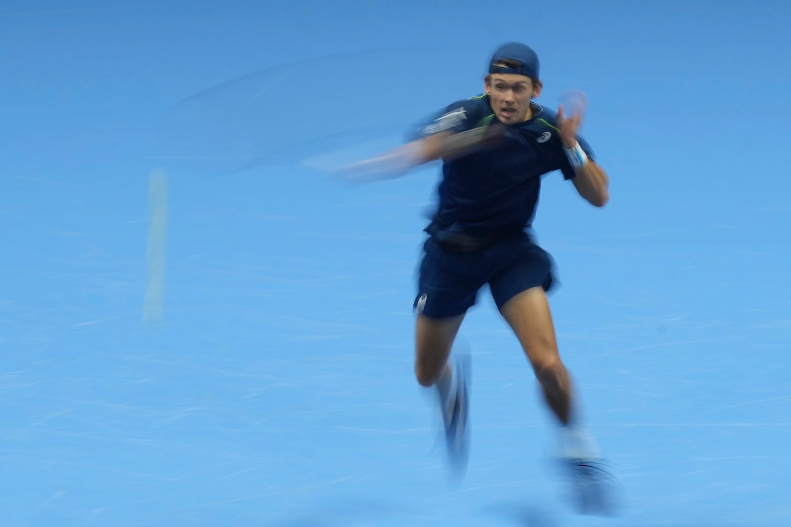 Australia's Alex de Minaur returns the ball to Italy's Jannik Sinner during their singles tennis match of the ATP World Tour Finals at the Inalpi Arena, in Turin, Italy, Sunday, Nov. 10, 2024. (AP Photo/Antonio Calanni)