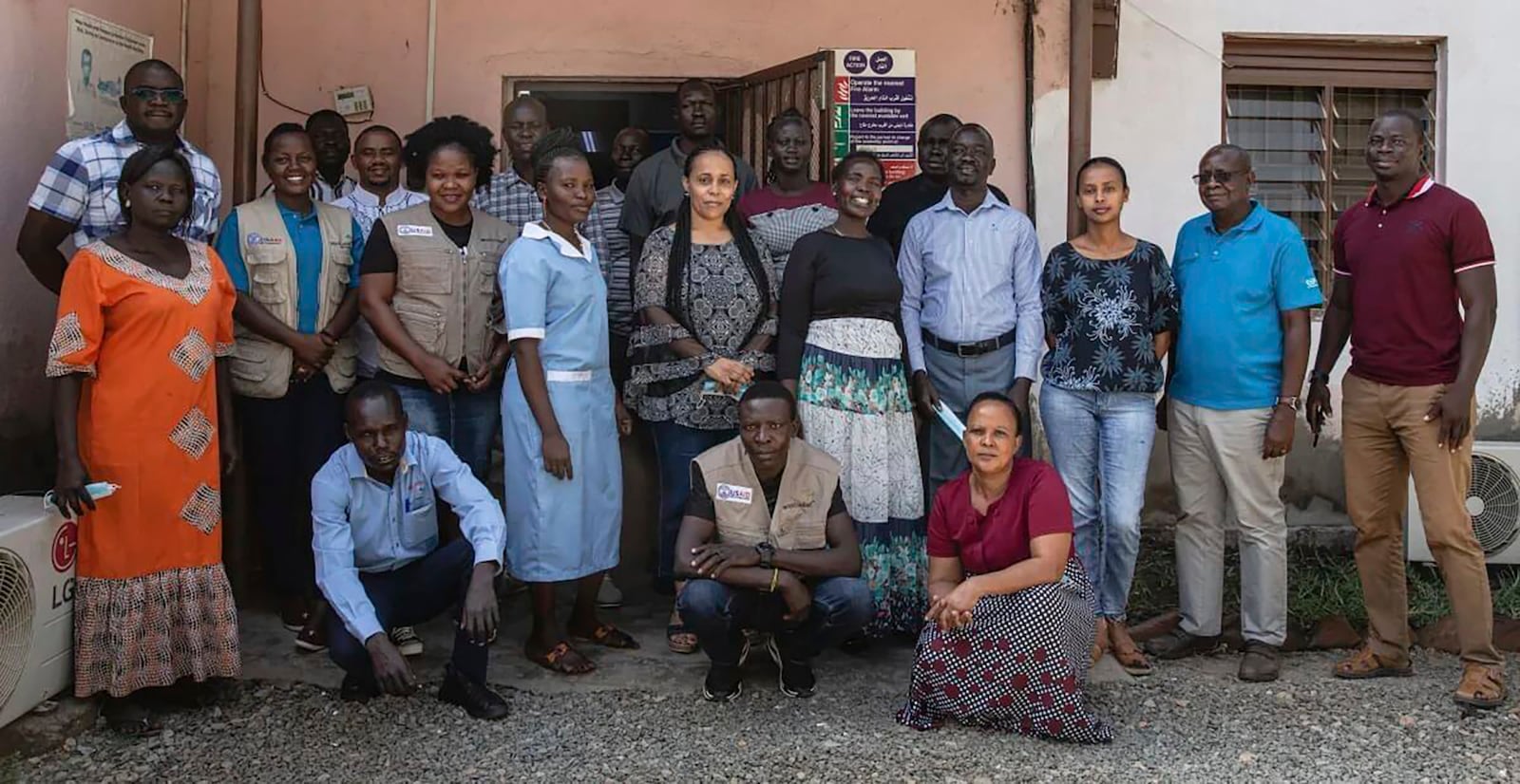 This photo provided by World Relief shows World Relief staff in front of their office in January 2022, in Juba, South Sudan. (Esther Mbabazi/World Relief via AP)