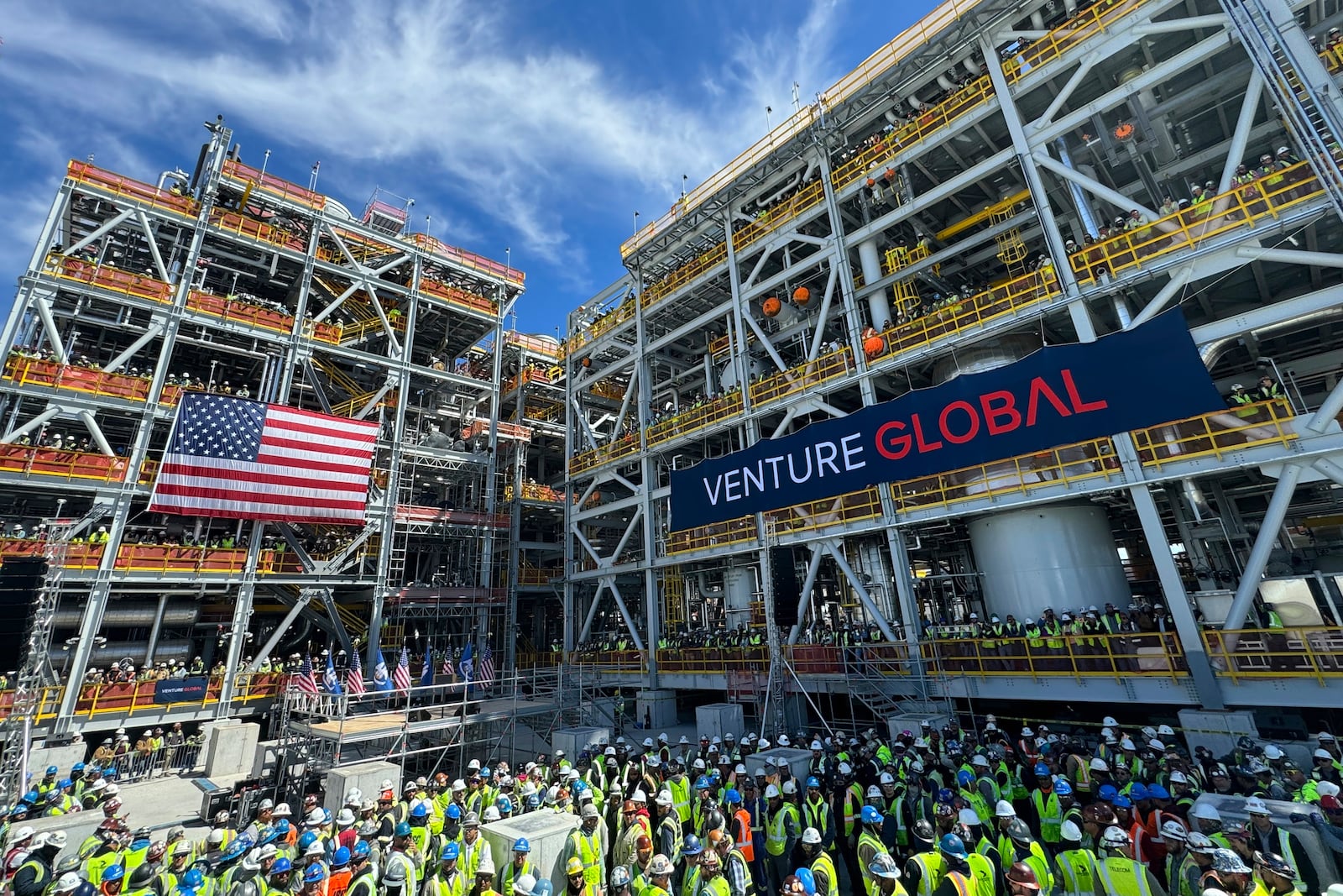 Venture Global workers await a rally with Secretary of Interior Doug Burgum and Secretary of Energy Chris Wright, Thursday, March 6, 2025, in Plaquemines Parish, La., where the company is investing billions of dollars in building out liquified natural gas export facilities. (AP Photo/Jack Brook)