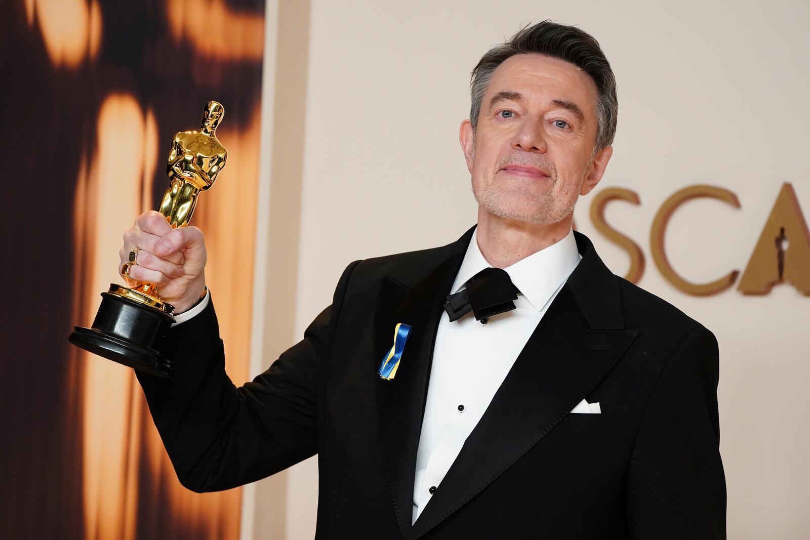 Peter Straughan, winner of the award for best adapted screenplay for "Conclave," poses in the press room at the Oscars on Sunday, March 2, 2025, at the Dolby Theatre in Los Angeles. (Photo by Jordan Strauss/Invision/AP)