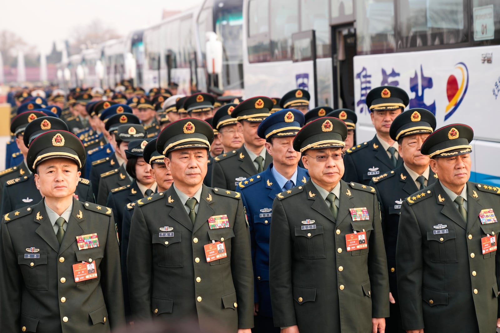 Military wait to attend the opening session of the National People's Congress (NPC) at the Great Hall of the People in Beijing, China, Wednesday, March 5, 2025. (AP Photo/Andy Wong)