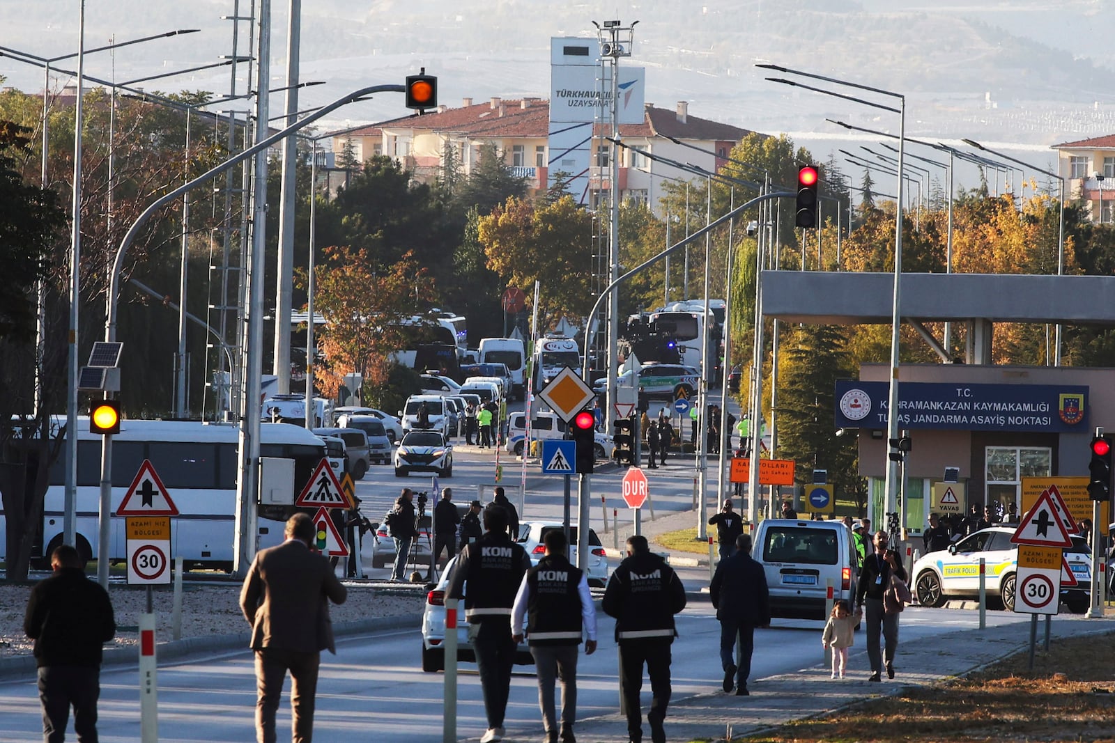 Emergency and security teams are deployed outside of Turkish Aerospace Industries Inc. at the outskirts of Ankara, Turkey, Wednesday, Oct. 23, 2024. (Yavuz Ozden/Dia Photo via AP)