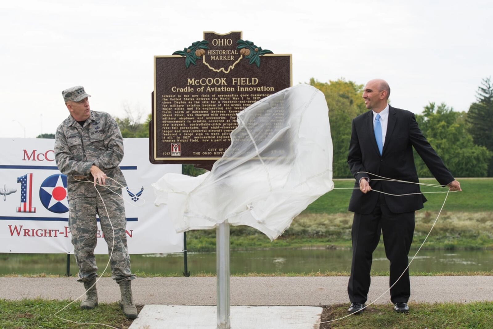 Lt. Gen. Robert D. McMurry Jr., then-commander of the Air Force Life Cycle Management Center, Wright-Patterson Air Force Base, and Matt Joseph, City of Dayton commissioner, unveil a new McCook Field historical marker during the McCook Field Centennial ceremony in Dayton, Ohio, Oct. 6, 2017. (U.S. Air Force photo by Wesley Farnsworth)