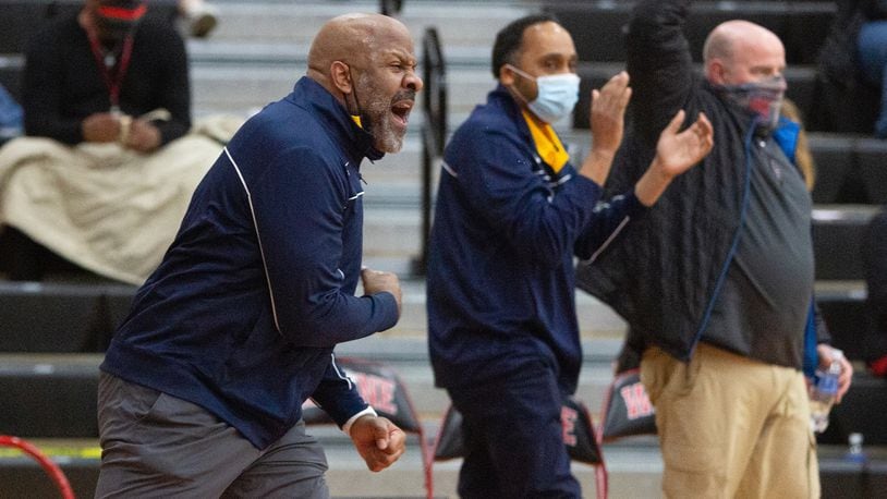 Springfield coach Shawn McCullough reacts to his team's 59-57 victory at ninth-ranked Wayne Friday night. Jeff Gilbert/CONTRIBUTED