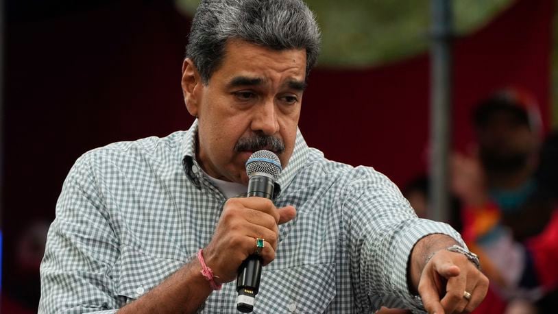 Venezuela's President Nicolas Maduro addresses government loyalists gathered at the presidential palace in support of his reelection one month after the presidential vote, in Caracas, Venezuela, Wednesday, Aug. 28, 2024. (AP Photo/Ariana Cubillos)