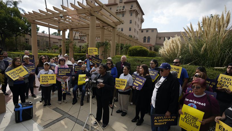 Guerline Jozef, Executive Director of the Haitian Bridge Alliance, speaks in front of demonstrators outside of the Richard H. Chambers U.S. Court of Appeals ahead of an asylum hearing, Tuesday, Nov. 7, 2023, in Pasadena, Calif. (AP Photo/Marcio Jose Sanchez)