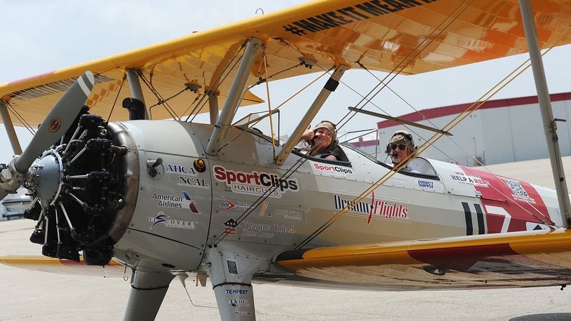 Dayton Daily News reporter Sydney Dawes flew with nonprofit Dream Flights on Wednesday at Dayton International Airport. Dream Flight offers seniors and veterans trips around the sky in a Stearman, which will be on display during the Dayton Air Show. Wednesday, July 19, 2023 was Dawes’ first-ever flight in an airplane. MARSHALLGORBY\STAFF
