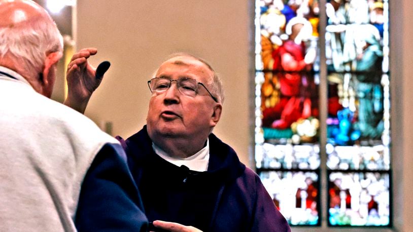 After 46 years, Father John MacQuarrie will retire in June. He was ordained on June 17, 1978, and has served churches throughout the area, including in Cincinnati, Dayton, West Milton and Springfield.
His return to Clark County also marked a quick reconnection with Springfield, and in 2014 a new church assignment at St. Bernard Catholic Church, where he has been pastor for the last 10years. He also provides service to the St. Theresa, St. Raphael and St. Joseph parishes in Springfield, as well as that of St. Charles in South Charleston. BILL LACKEY/STAFF