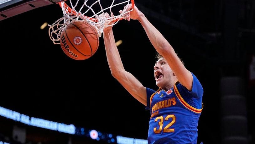 FILE - East forward Cooper Flagg dunks on a fast break during the third quarter of the McDonald's All American boys' basketball game Tuesday, April 2, 2024, in Houston. The incoming Duke freshman is among the potential headliners for the 2025 NBA draft.(AP Photo/Kevin M. Cox)